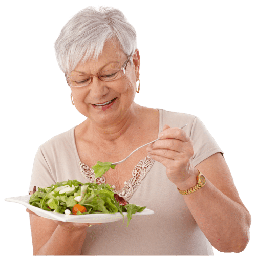 Elder woman eating salad